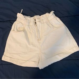white “paper bag” style shorts